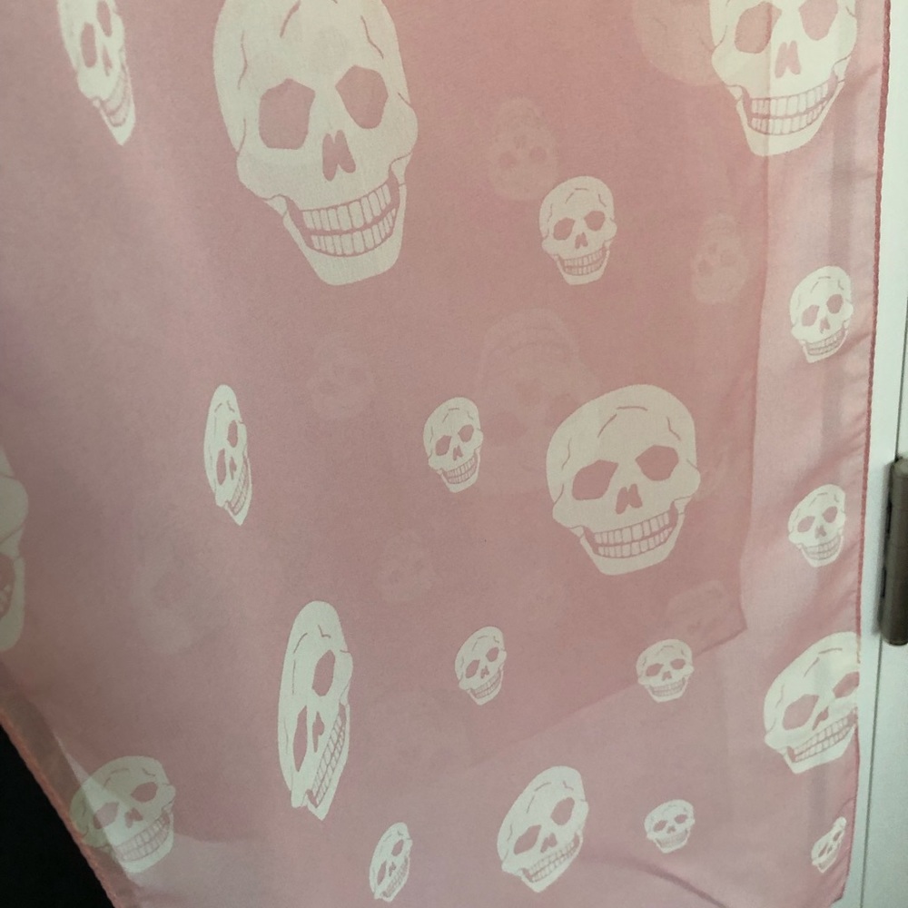 Sheer light pink rectangular scarf w/skull design